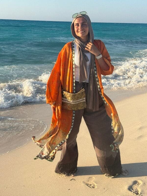 “Orange paisley-inspired kimono with oriental floral accents – perfect for effortless beach elegance.” - Image 4