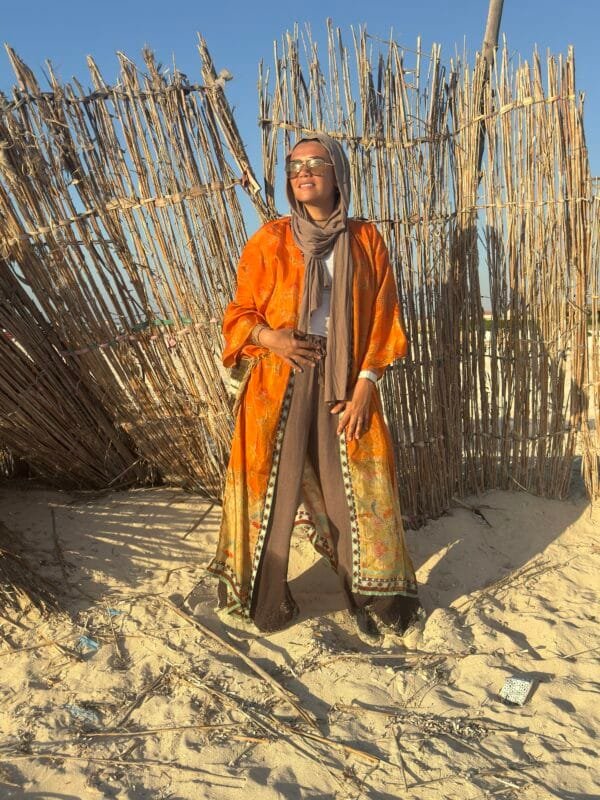“Orange paisley-inspired kimono with oriental floral accents – perfect for effortless beach elegance.” - Image 3