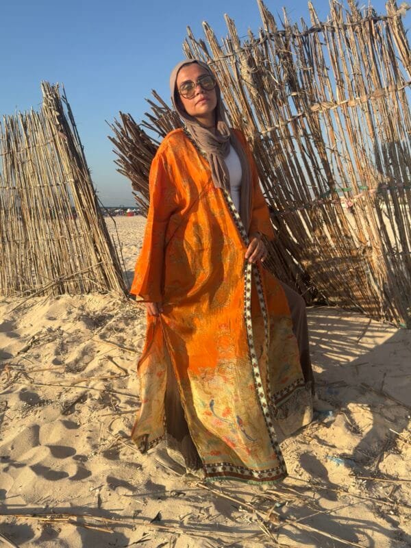 “Orange paisley-inspired kimono with oriental floral accents – perfect for effortless beach elegance.” - Image 2